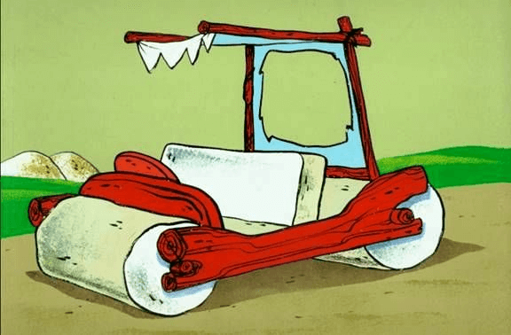 The vehicle driven by the cartoon character Fred Flintstone, consisting of a wooden frame holding a stone pew and two steamroller-like wheels.